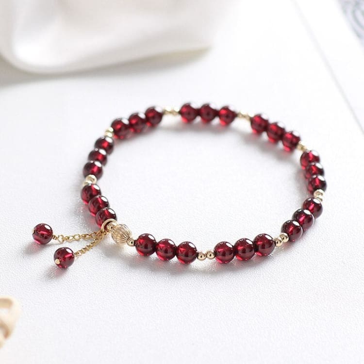 Bracelet de force grenat rouge