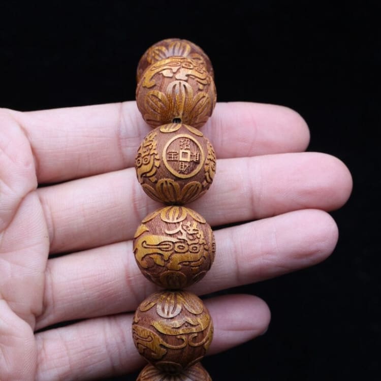 Bracelet des ancêtres en bois de santal doré