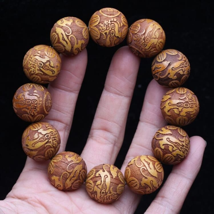 Bracelet des ancêtres en bois de santal doré